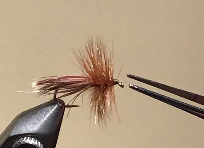 Making clean fly heads