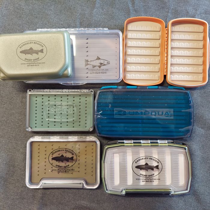 seven of many different fly boxes available at the Rangeley Region Sport Shop