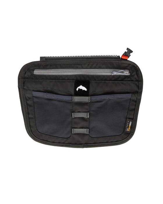 The front of the carbon color simms tippet tender pocket that zips into simms waders