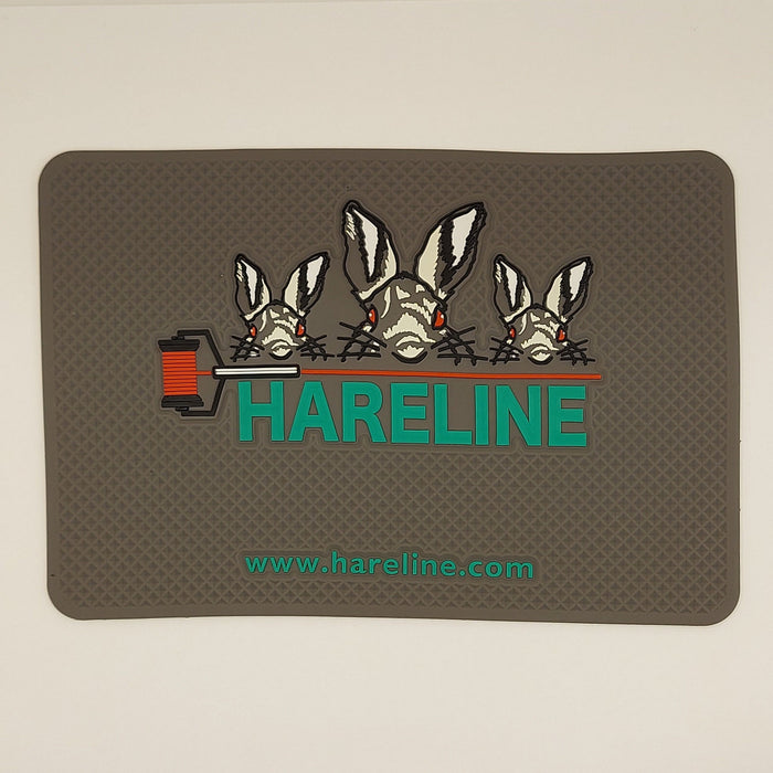 silicone bead pad from Hareline with their logo of three hares and a bobbin of red thread