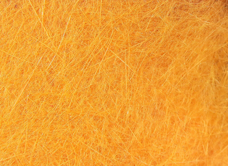 Close up of amber colored Hareline Dubbin