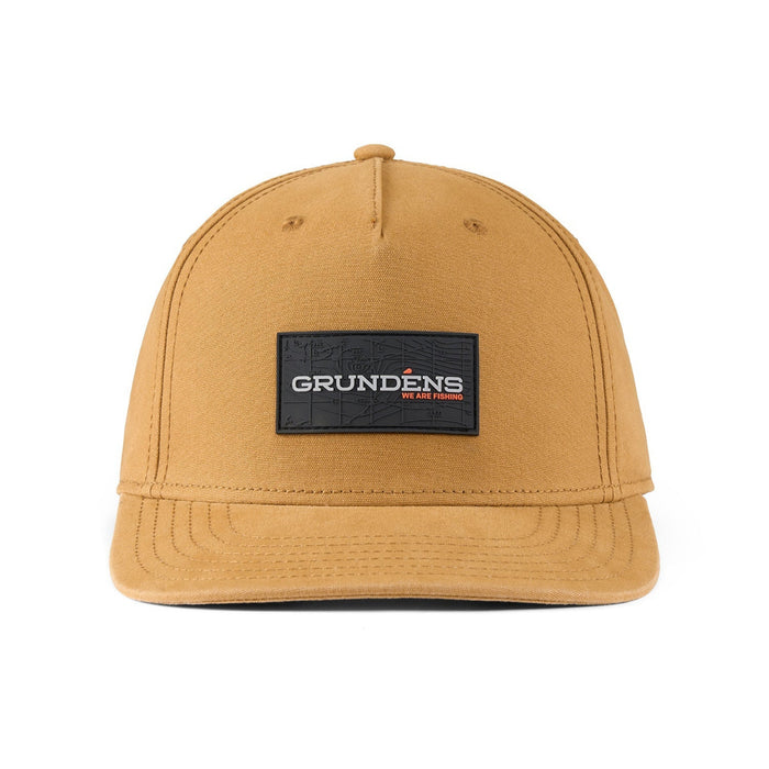 a tan canvas ball cap with a Grundens patch