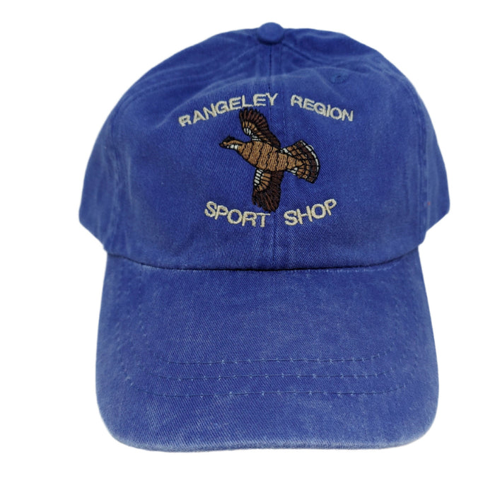 a blue hat embroidered with a flying grouse and shop name