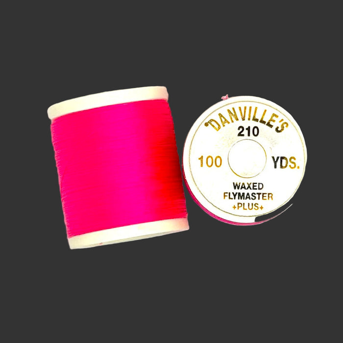 Fluorescent red/hot pink spool of thread from top and side view