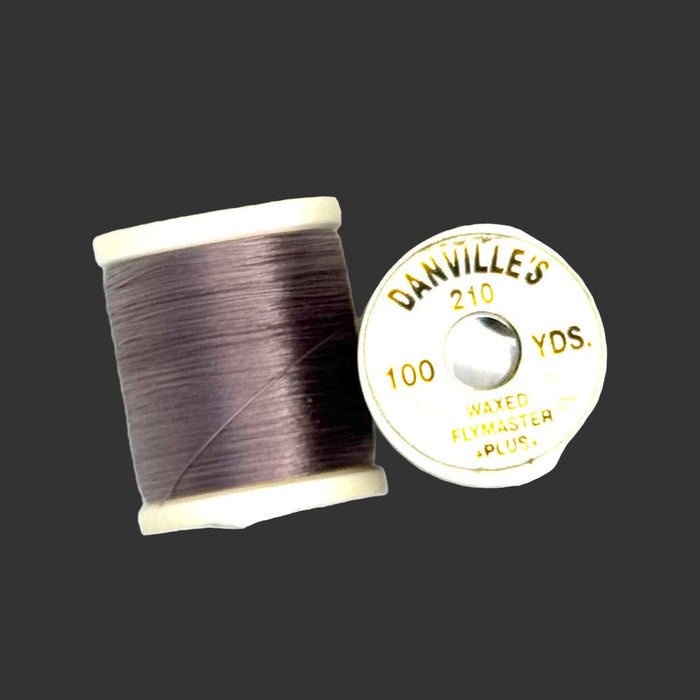 Gray spool of thread from top and side view