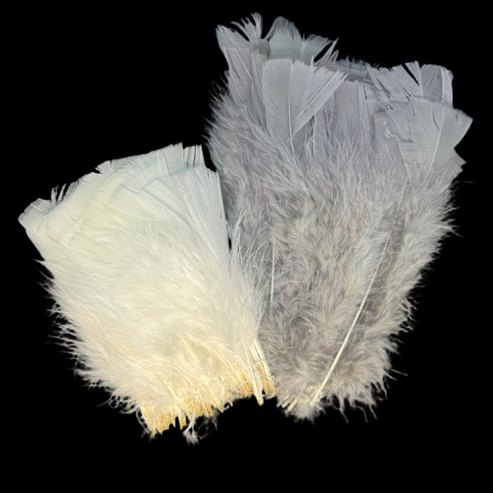 Two flat bunches of turkey feathers in white and grey