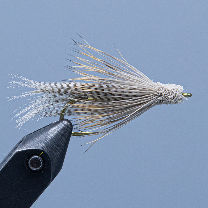 a natural (tan) colored Kennebago Muddler fishing fly