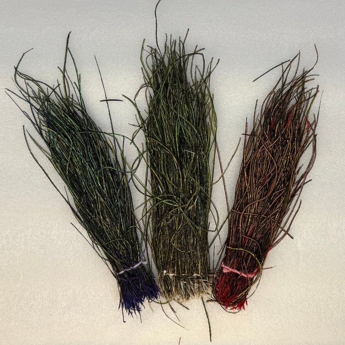 Three  different colors of strung Peacock Herl bundles