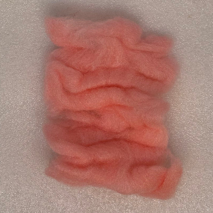 Close up Shrimp pink colored sparkle dubbing