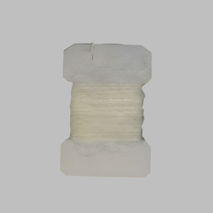White colored leach yarn on a card