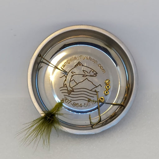 A magnetic nickel colored dish for holding beads, hooks, and flies while fly tying.  Engraved with Rangeley fly shop logo. Shown holding hooks, beads, and an Olive Wiggle fly