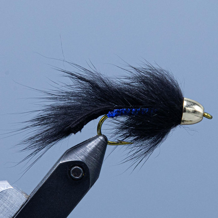 Black slump buster made with blue body and black rabbit fur from Rangeley Maine fly fishing shop