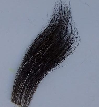 a piece of moose mane fur used for tying flies from a maine fly shop