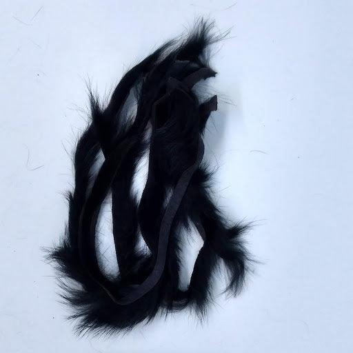 the contents of one package of zonker strips - narrow slices of rabbit fur used in fly tying available from a Maine Fly Shop