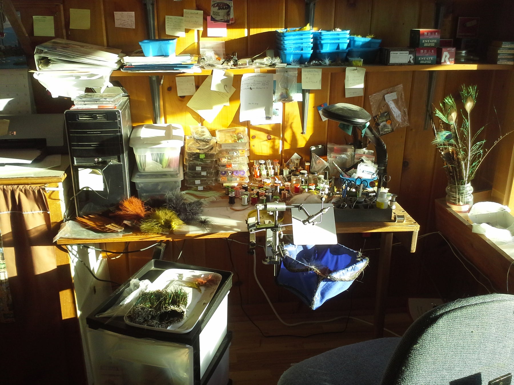 a very messy but productive fly tying bench in the Rangeley Region Sport Shop