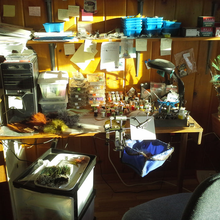 a very messy but productive fly tying bench in the Rangeley Region Sport Shop