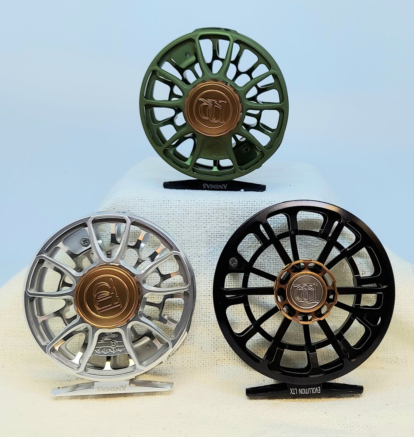 three of many ross fly fishing reels available at the Rangeley Region Sport Shopthe 