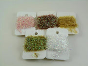 Assorted chenille tinsel swatches with pink, green, gold, and silver fibers