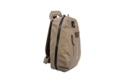 Tan sling bag side view with black trim, zip pocket, and webbing strap