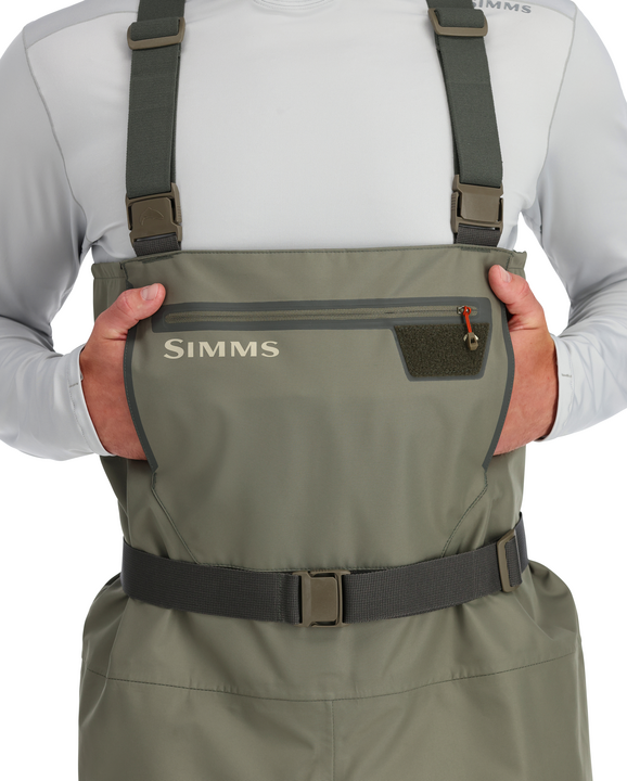 Stockingfoot wader chest pocket detail with Simms logo and adjustable suspenders
