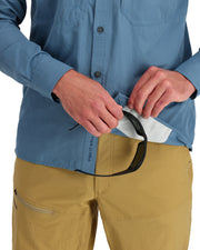 Men's guide shirt, light blue, showing hands near chest pocket and hidden strap