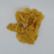 CCT body fur swatch in golden yellow with dense fuzzy fibers