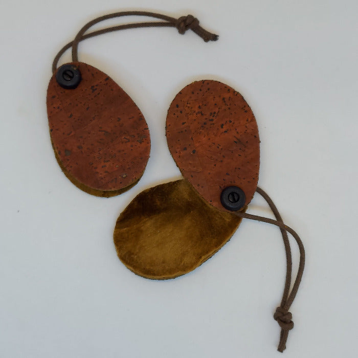 Cork fly dryer with three oval cork pads and drawstring ties, dark brown