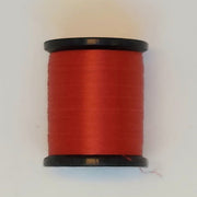 Uni Thread 6/0 spool, red thread wound on a black core