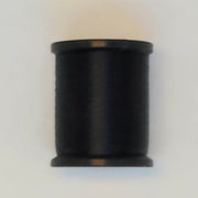 Uni Thread 6/0 spool, black thread wound on a black core