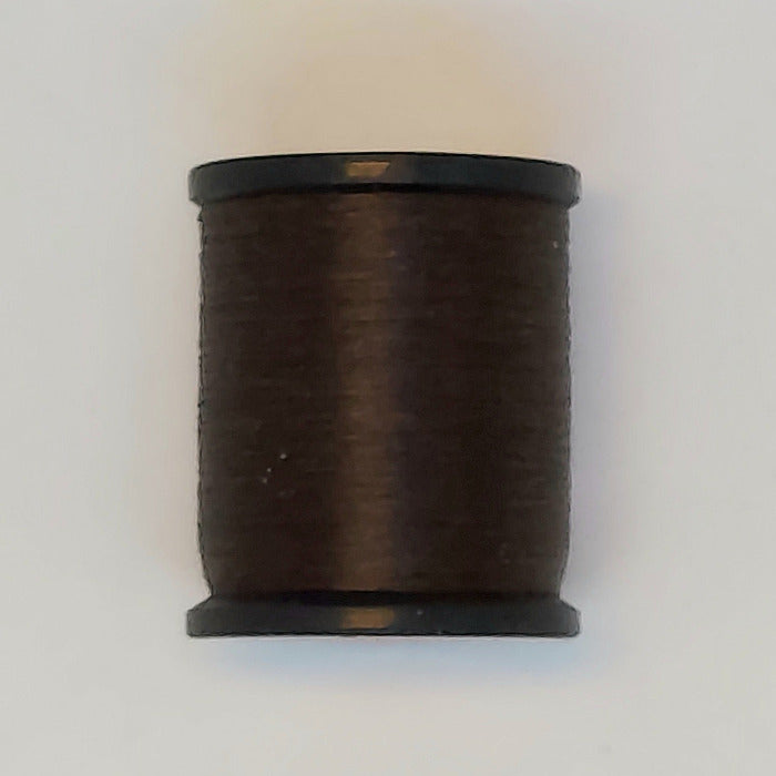 Sewing thread spool, dark brown