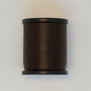 Brown thread spool with black caps