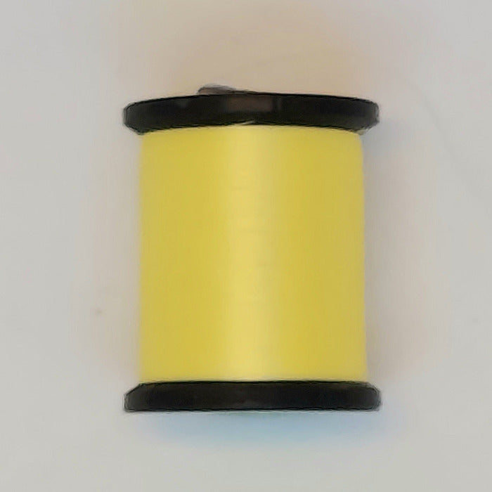 Yellow sewing thread spool with black ends