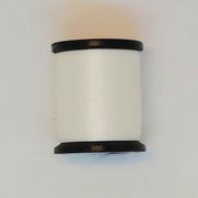 White sewing thread spool with black ends