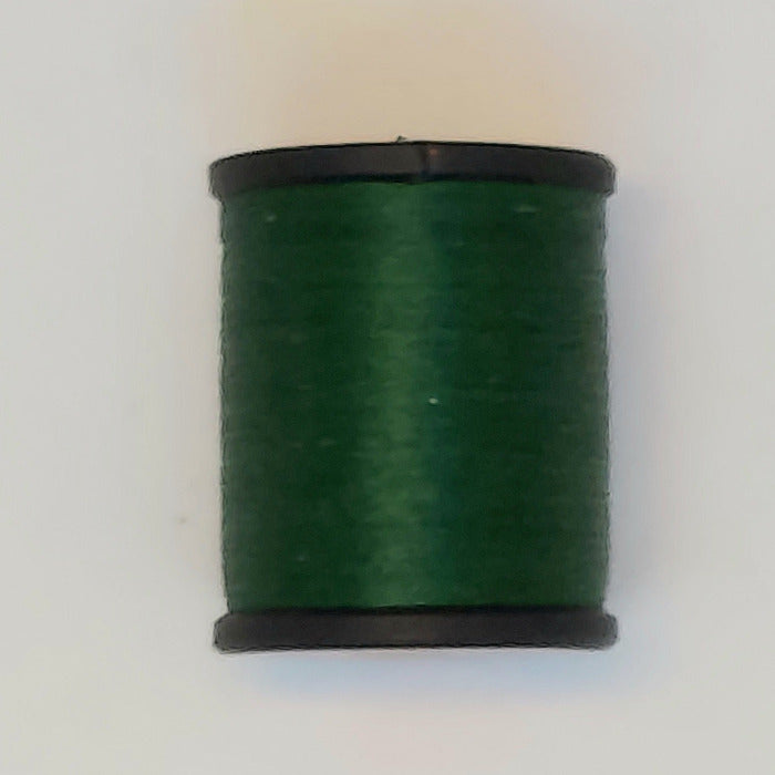 Green thread spool with black end caps