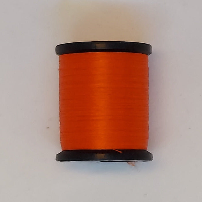 Orange sewing thread spool with black ends
