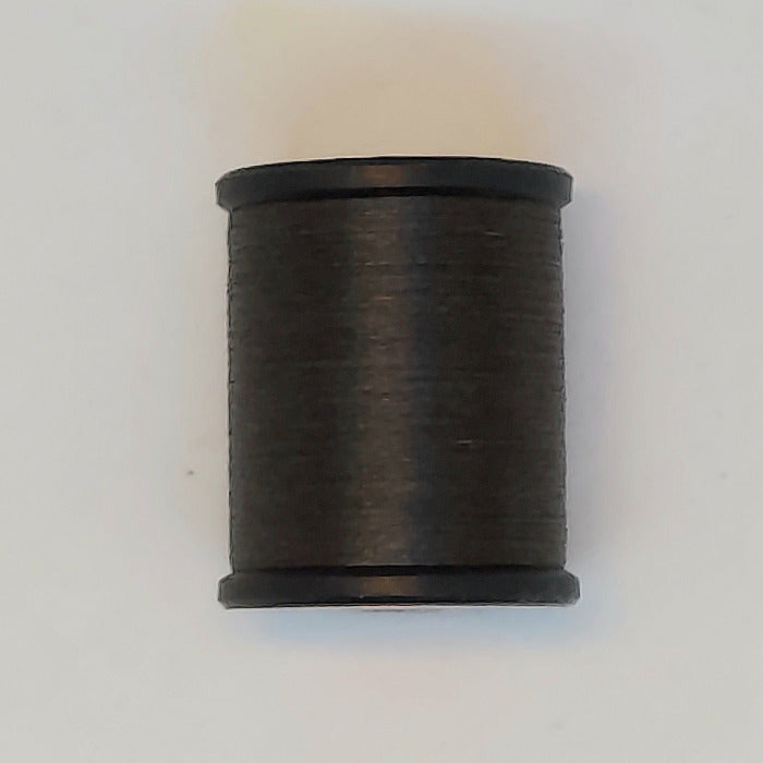 Dark gray thread spool with black caps