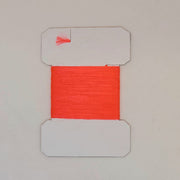 Red yarn on cards, bright red fibers wound on a white card