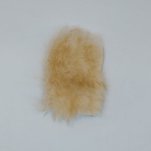 a furry pin-on patch to hold fishing flies 