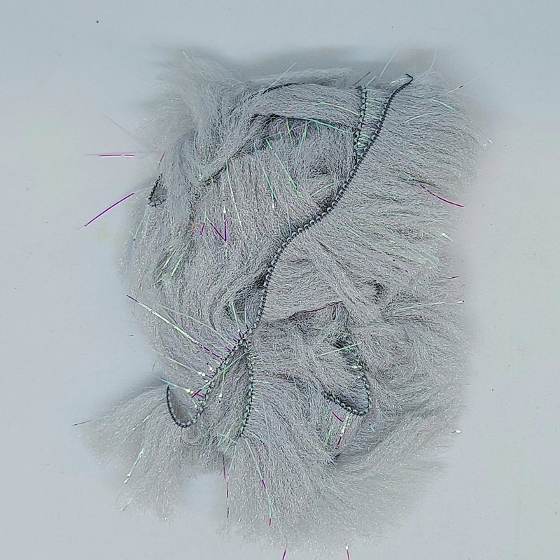 CCT body fur swatch in light gray with shaggy fuzzy fibers