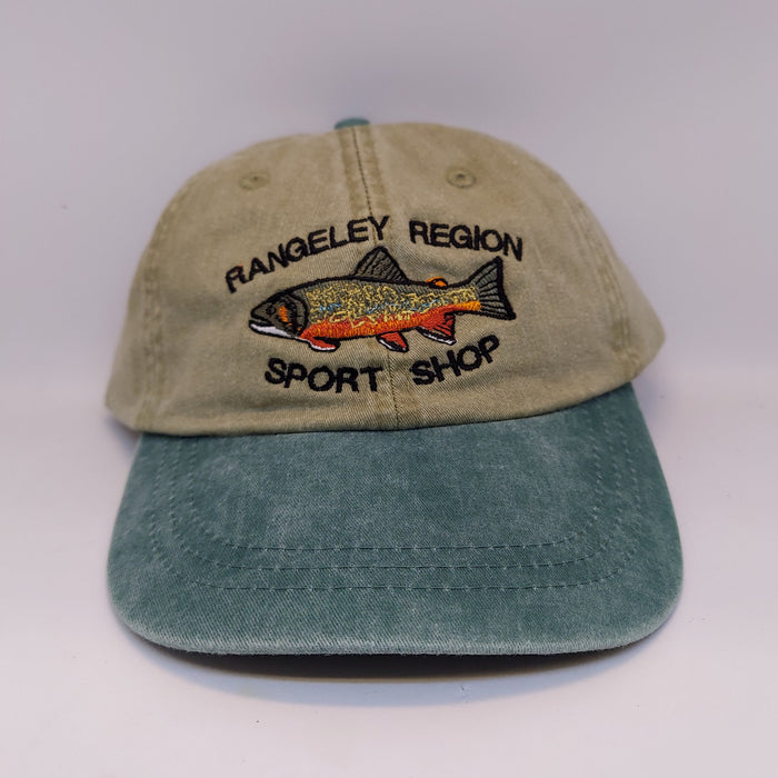 A khaki Adams hat embroidered with brook trout and shop name with green bill