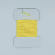 Woolly Bugger yarn on cardboard spool, bright yellow