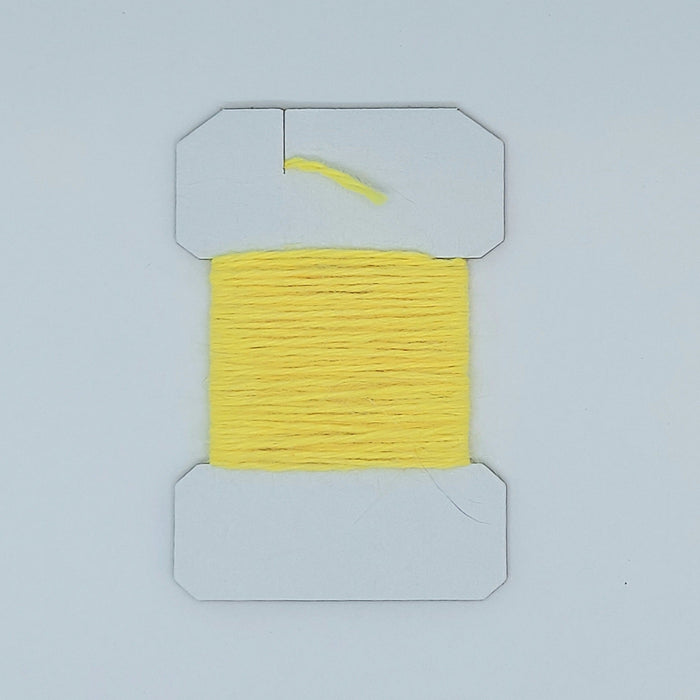 a card of yellow "cheese" colored soft yarn