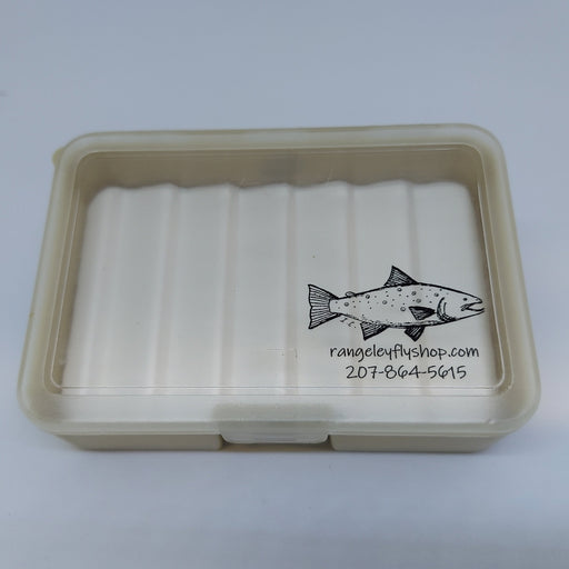 A small fly box with tan bottom with ripple foam and clear lid with rangeleyflyshop.com logo