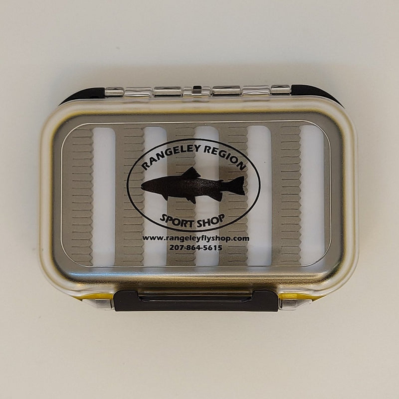 Double-sided water-resistant fly box, closed tan shell with Rangeley Region logo