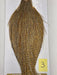 Mustard-gold and dark speckled hackle cape with fine feather fibers, side view.