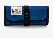 Streamer stash roll with blue fabric and black strap, snap button flap