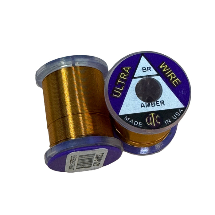 Spool of amber colored brassie ultra wire