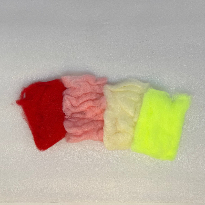 Antron sparkle dub material in red, pink, cream, and lime tones