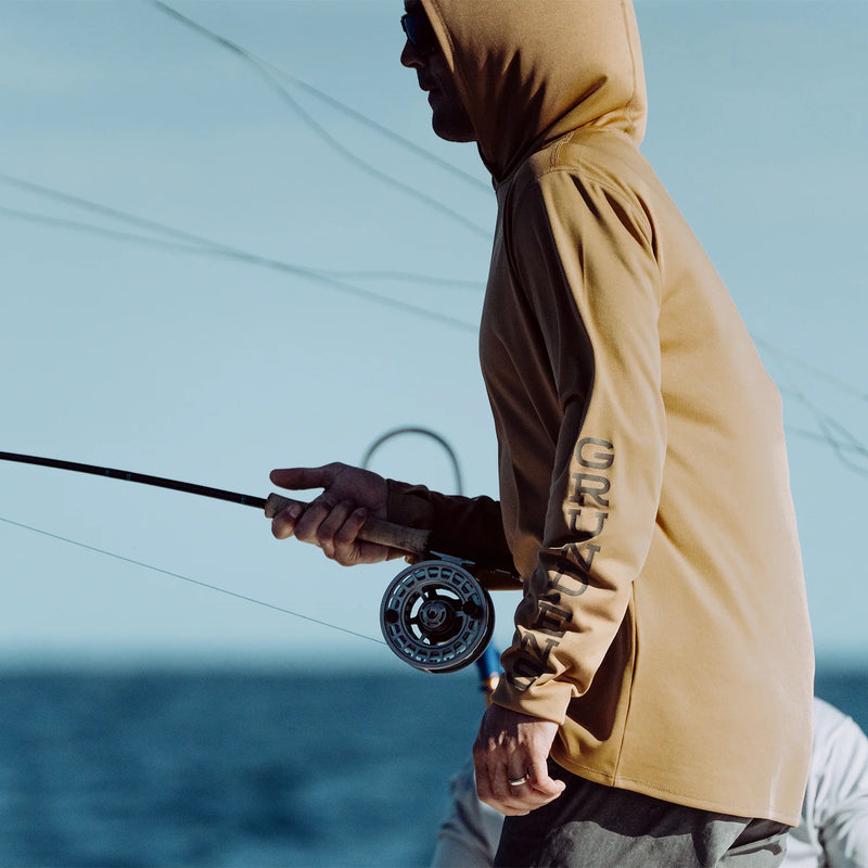 Tan hooded sun hoodie with long sleeves and sleeve logo detail