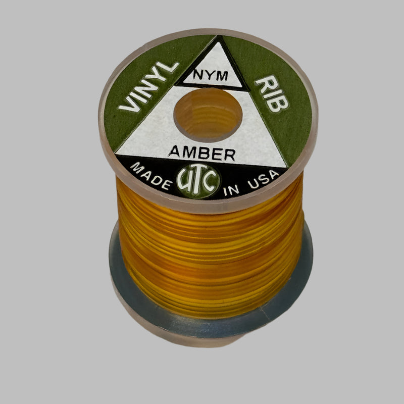Vinyl D-rib spool of Amber vinyl trim, wound on a small reel